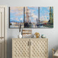 Three-panel canvas wall art featuring busy river port scene, displayed above a cabinet in an entryway.