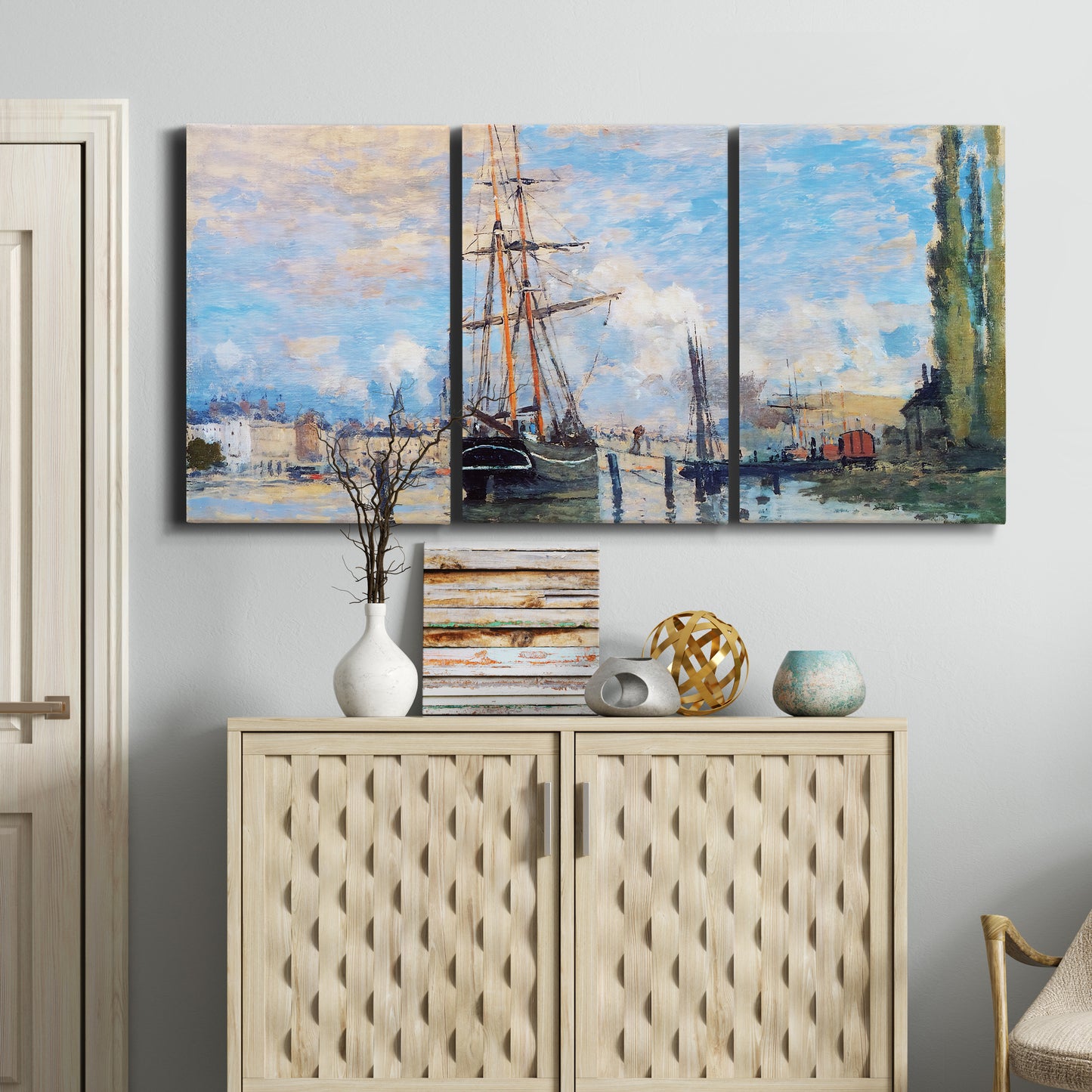 Three-panel canvas wall art featuring busy river port scene, displayed above a cabinet in an entryway.