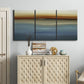 Three-panel canvas wall art featuring horizontal abstract coastal color bands, displayed above a cabinet in an entryway.