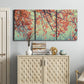Three-panel canvas wall art featuring autumn foliage landscape photograph, displayed above a cabinet in an entryway.