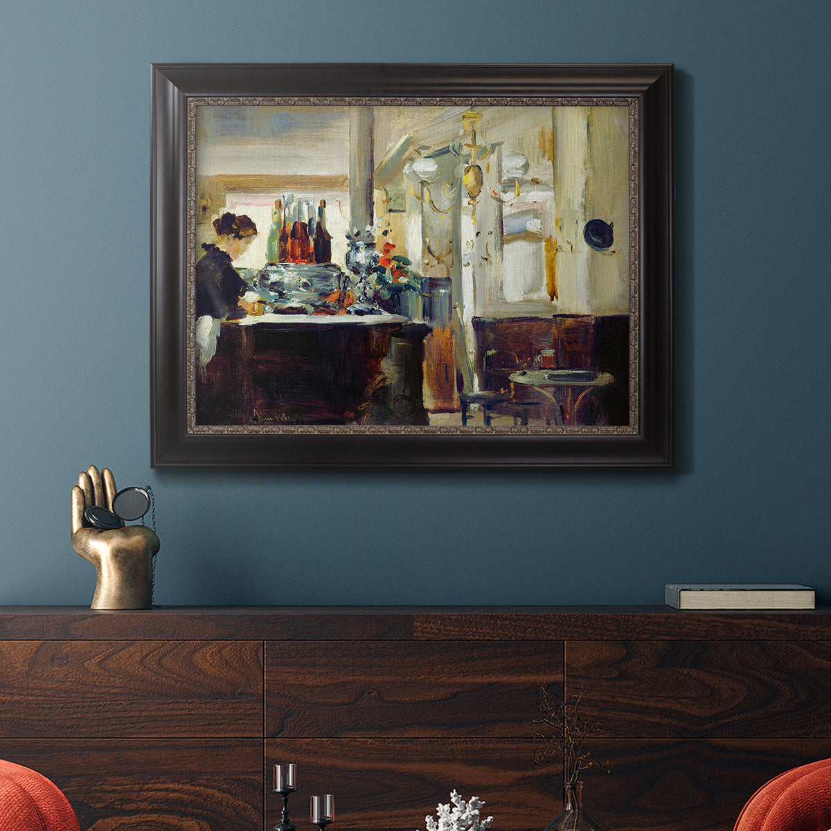 Impressionist café still life scene by Édouard Manet in an ornate black frame with gilded inner detail displayed in a dark-toned interior setting.