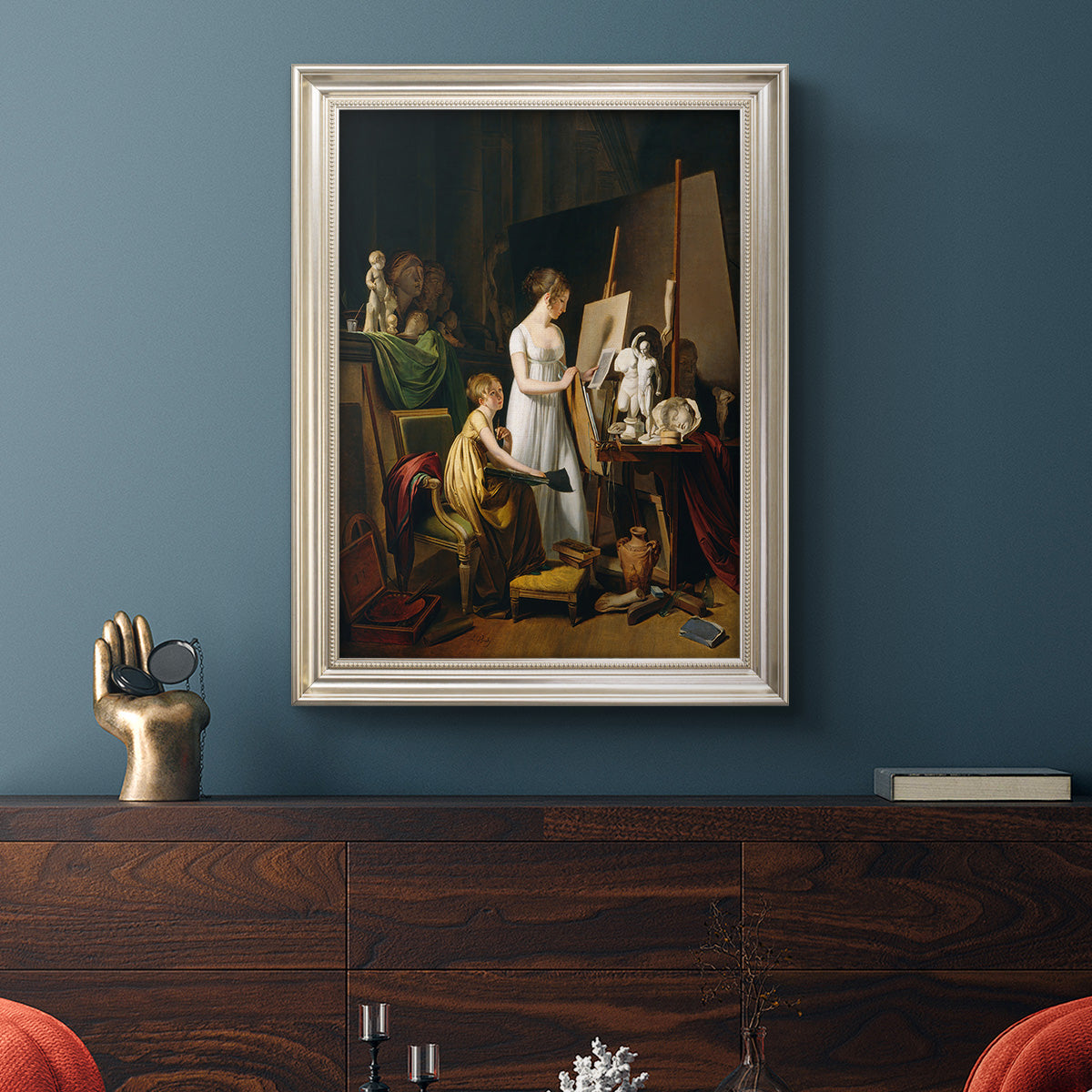 Classical interior painting of an artist at work by Louis-Leopold Boilly in an ornate champagne frame displayed in a dark-toned interior setting.