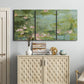 Three-panel canvas wall art featuring muted water lily pond, displayed above a cabinet in an entryway.