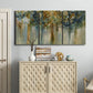 Three-panel canvas wall art featuring earth toned abstract leaf textures, displayed above a cabinet in an entryway.