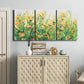 Three-panel canvas wall art featuring colorful garden flowers in bloom, displayed above a cabinet in an entryway.