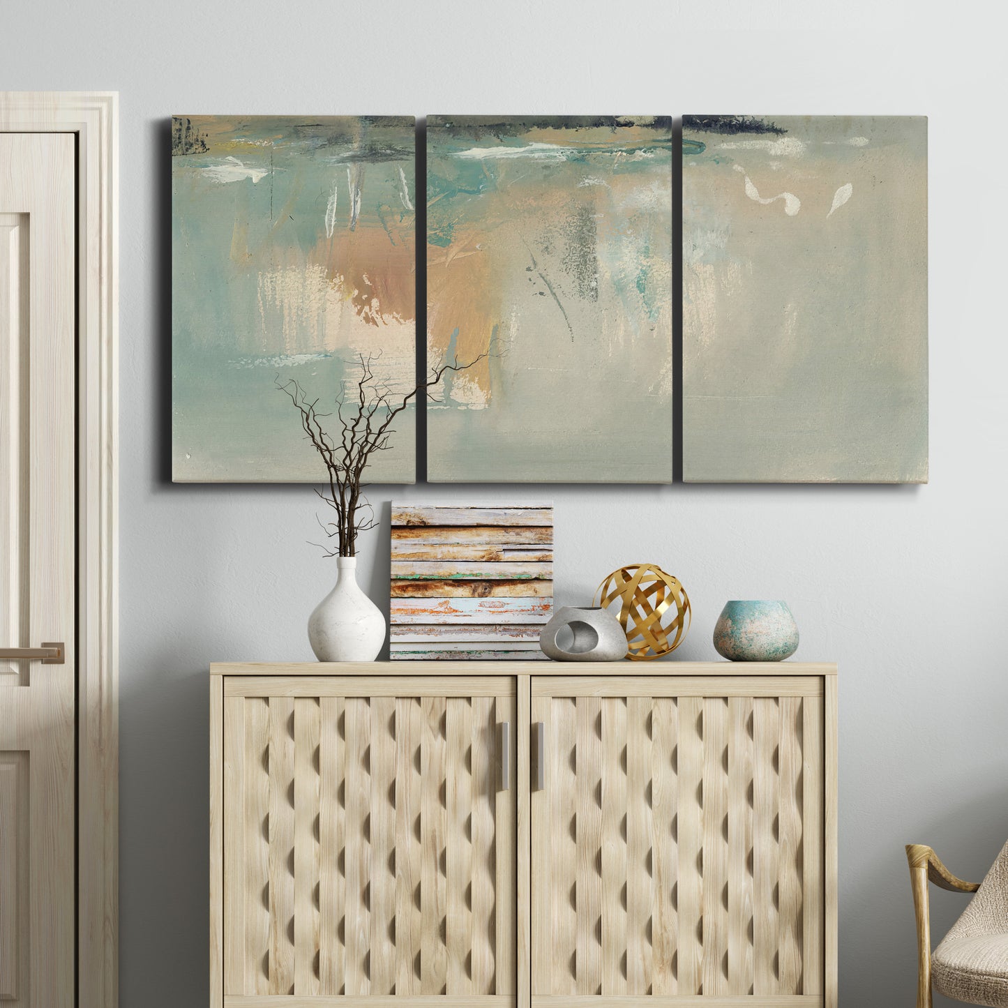 Three-panel canvas wall art featuring minimalist abstract emotional fields, displayed above a cabinet in an entryway.