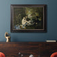 Groundbreaking impressionist picnic scene by Édouard Manet in an ornate black frame with gilded inner detail displayed in a dark-toned interior setting.