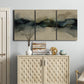 Three-panel canvas wall art featuring calm abstract water surface stillness, displayed above a cabinet in an entryway.