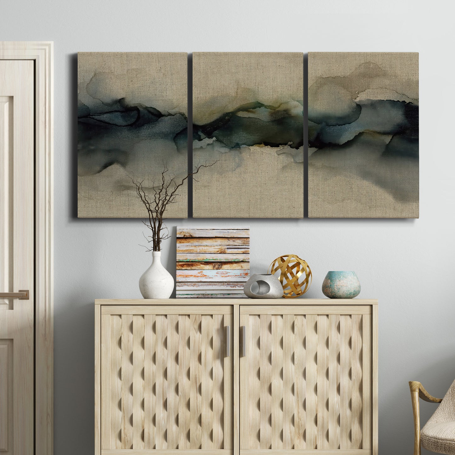 Three-panel canvas wall art featuring calm abstract water surface stillness, displayed above a cabinet in an entryway.