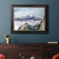 Impressionist alpine mountain landscape by John Singer Sargent in an ornate black frame with gilded inner detail displayed in a dark-toned interior setting.
