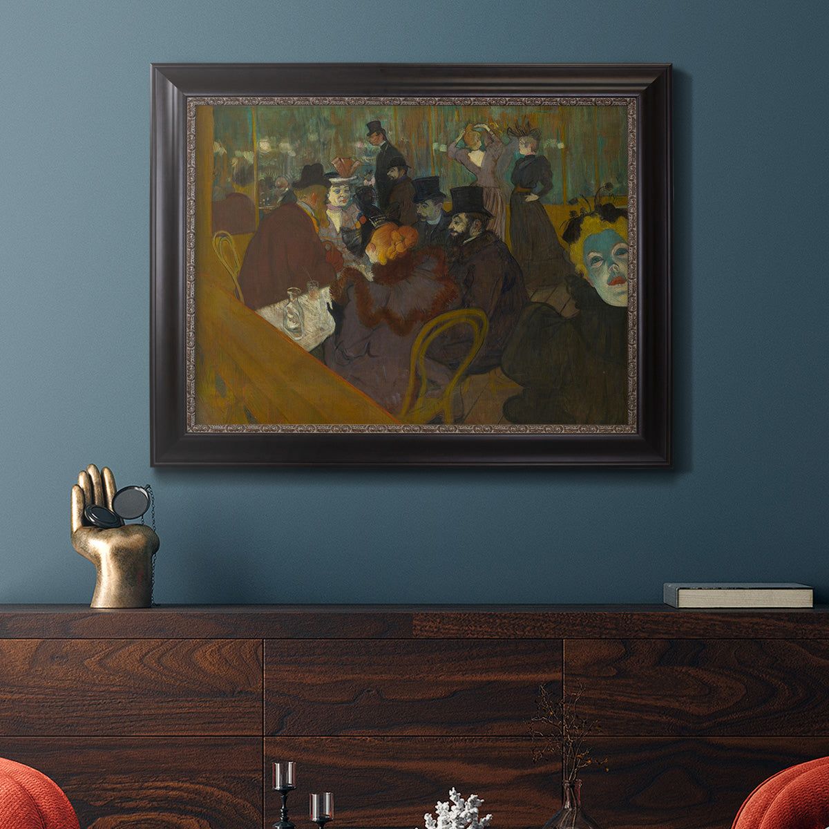 Impressionist cabaret interior scene by Henri de Toulouse-Lautrec in an ornate black frame with gilded inner detail displayed in a dark-toned interior setting.