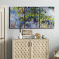 Three-panel canvas wall art featuring cascading purple wisteria blooms, displayed above a cabinet in an entryway.