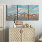 Three-panel canvas wall art featuring soft pastel western hills landscape, displayed above a cabinet in an entryway.