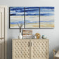 Three-panel canvas wall art featuring turbulent abstract ocean wave motion, displayed above a cabinet in an entryway.