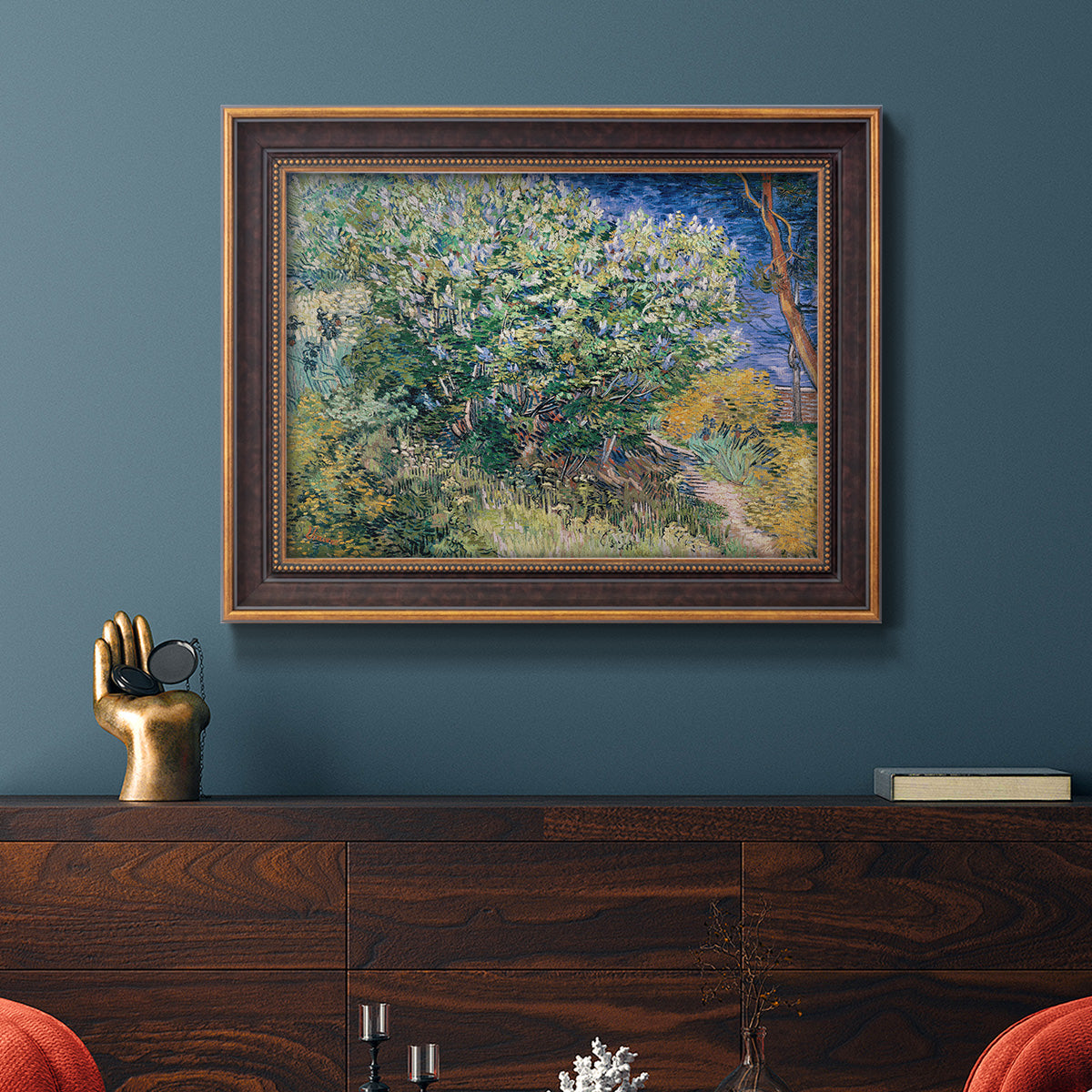 Impressionist lilac flower painting by Vincent van Gogh in an ornate bronzed mahogany wood frame displayed in a dark-toned interior setting.