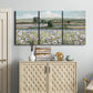 Three-panel canvas wall art featuring vintage poppy filled valley, displayed above a cabinet in an entryway.