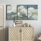 Three-panel canvas wall art featuring abstract evening landscape with depth, displayed above a cabinet in an entryway.