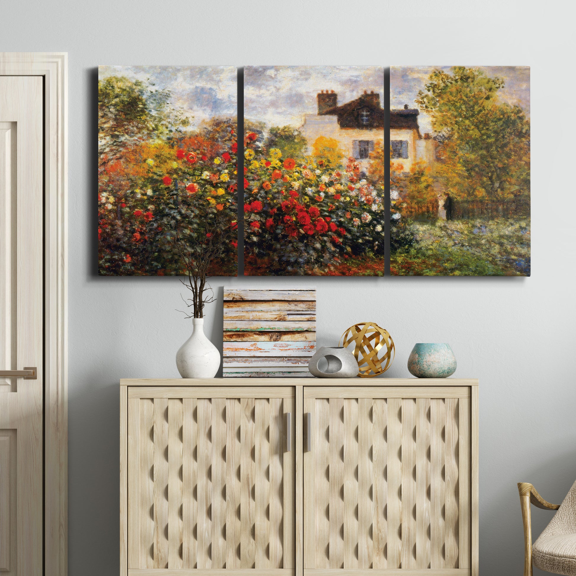Three-panel canvas wall art featuring farm buildings in rural normandy, displayed above a cabinet in an entryway.