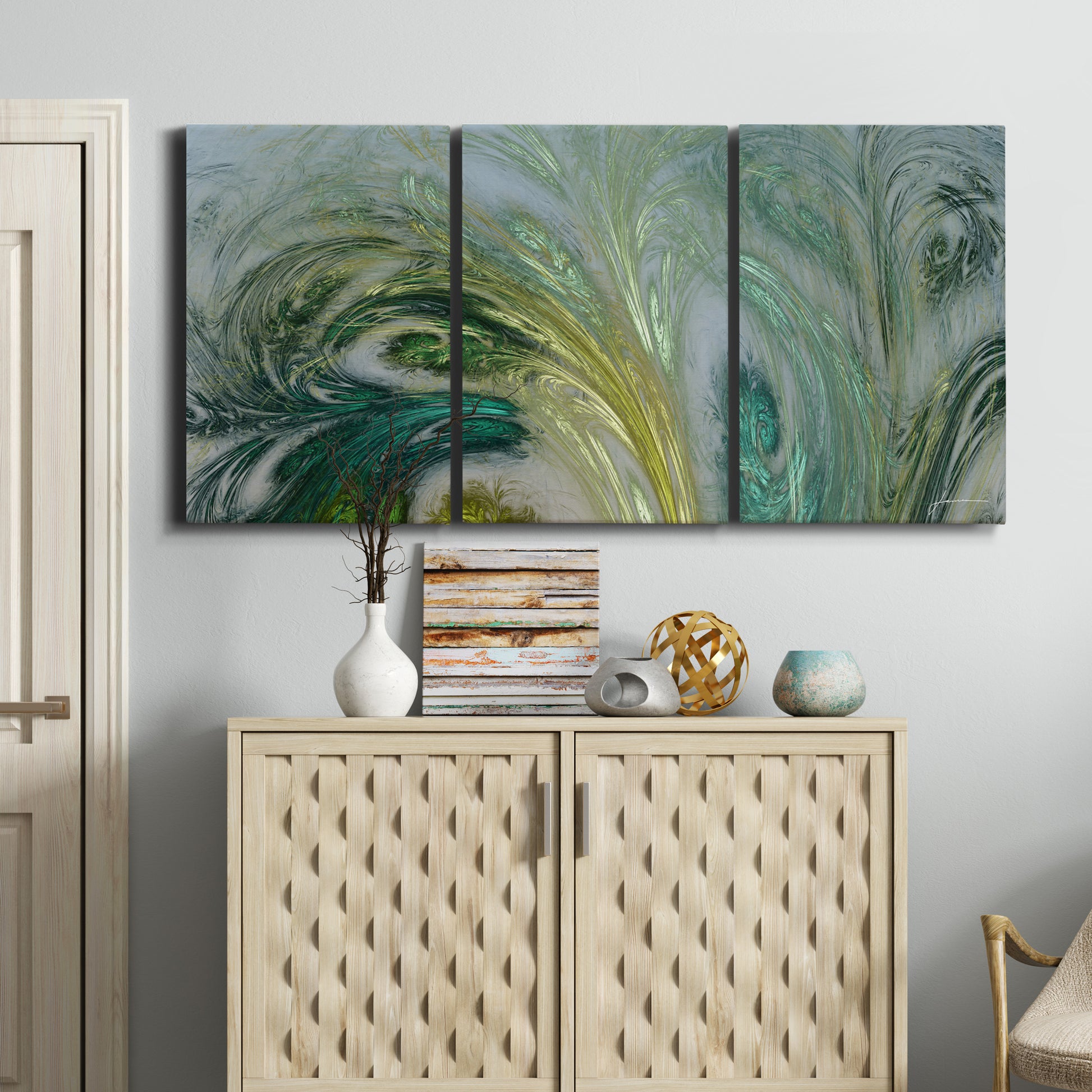 Three-panel canvas wall art featuring layered modern abstract landscape, displayed above a cabinet in an entryway.