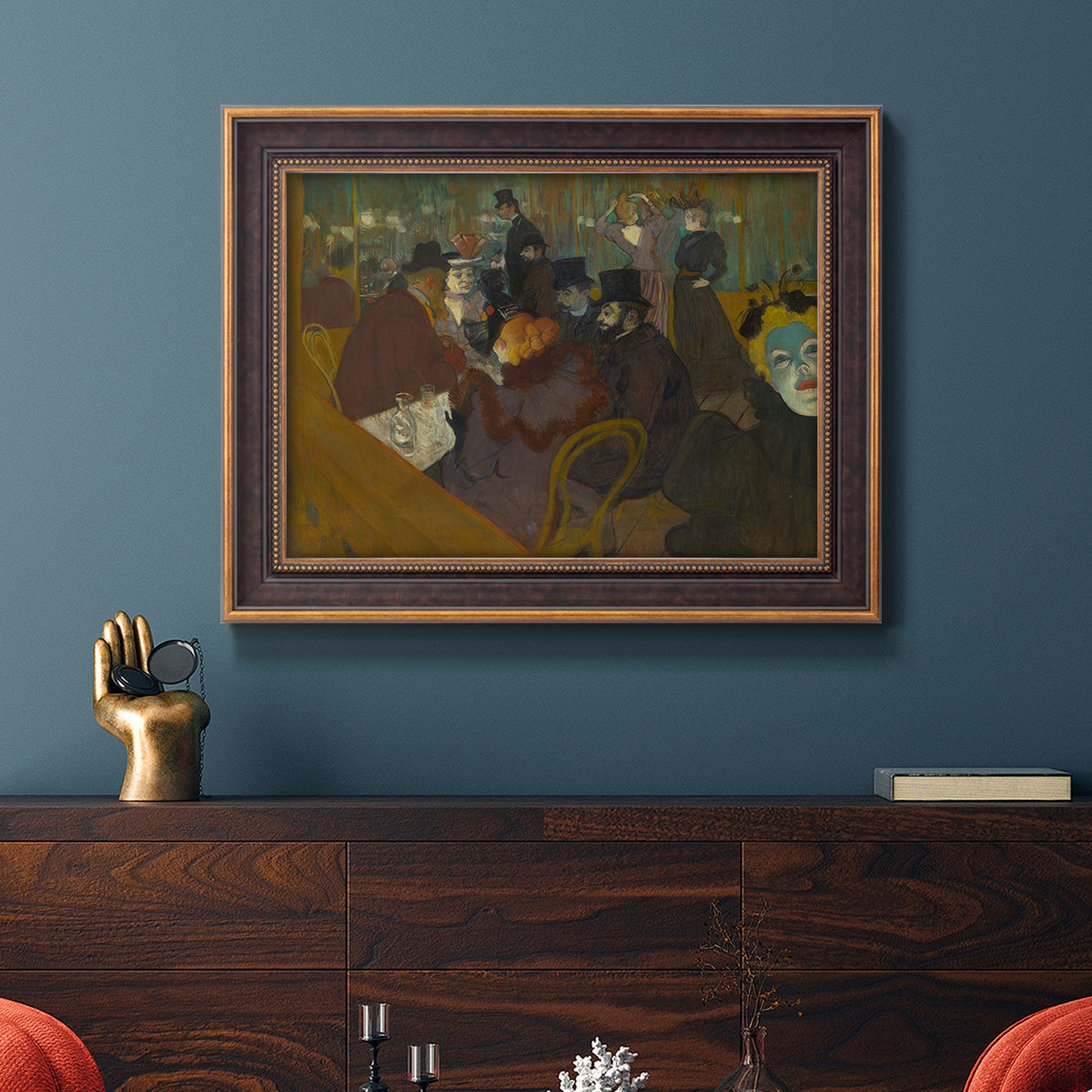 Impressionist cabaret interior scene by Henri de Toulouse-Lautrec in an ornate bronzed mahogany wood frame displayed in a dark-toned interior setting.