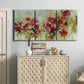 Three-panel canvas wall art featuring colorful floral garden composition, displayed above a cabinet in an entryway.