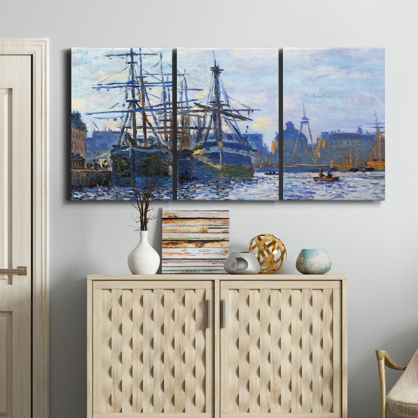 Three-panel canvas wall art featuring industrial dock along harbor, displayed above a cabinet in an entryway.