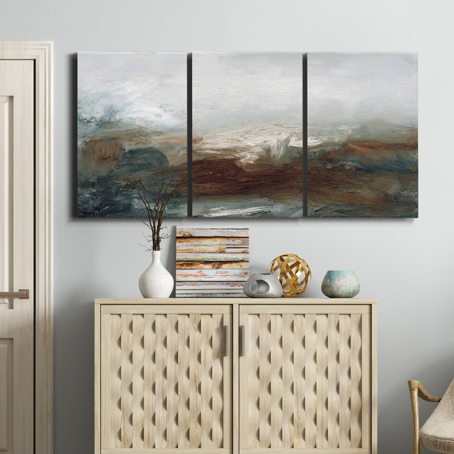 Three-panel canvas wall art featuring soft abstract evening light, displayed above a cabinet in an entryway.