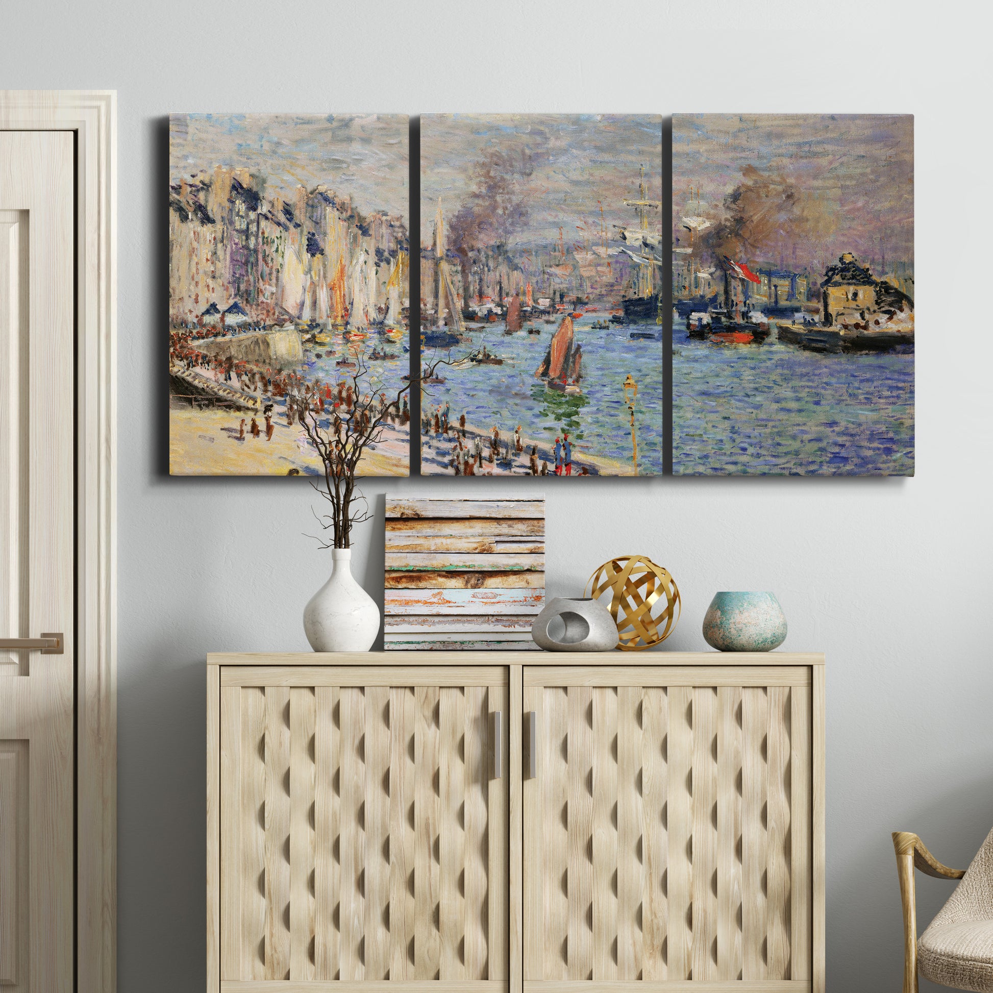 Three-panel canvas wall art featuring evening harbor with reflections, displayed above a cabinet in an entryway.