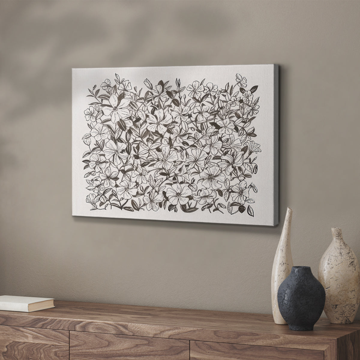 Floral pattern featuring intricate black and white illustrations of various flowers and foliage in a dense arrangement