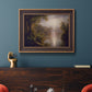 Luminous romantic landscape painting by Frederic Edwin Church in an ornate bronzed mahogany wood frame displayed in a dark-toned interior setting.