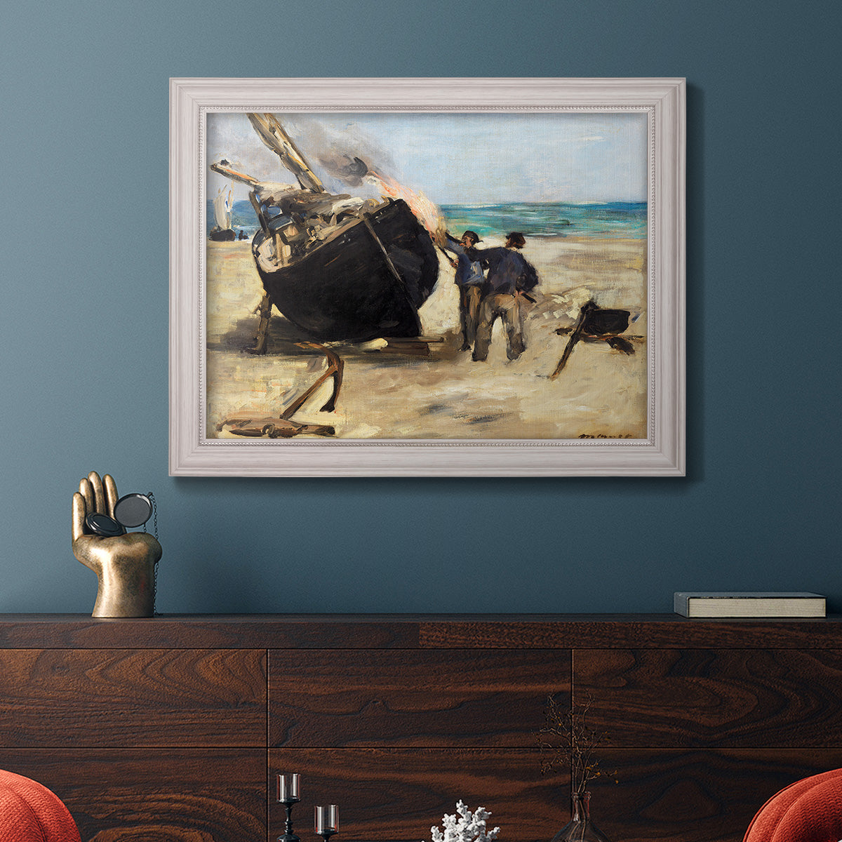 Impressionist nautical work scene by Édouard Manet in an ornate weathered white frame displayed in a dark-toned interior setting.