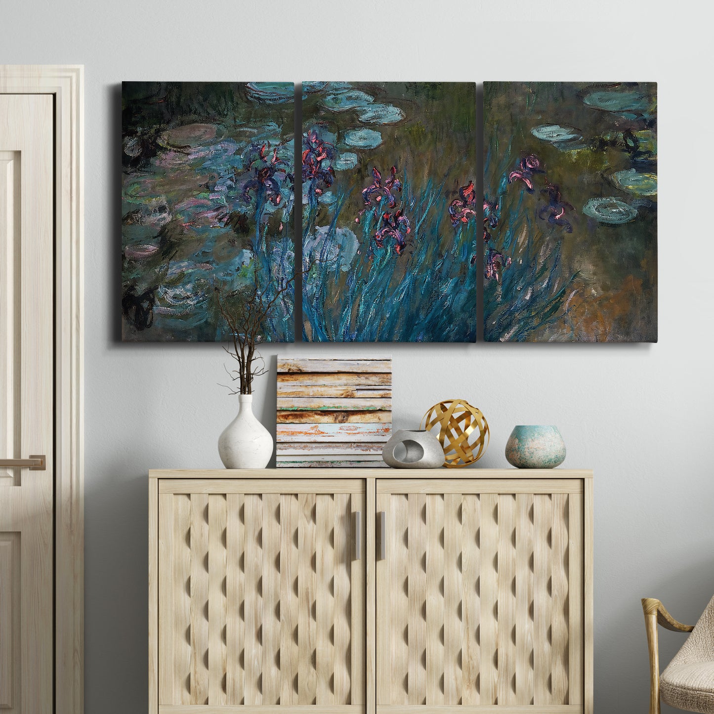 Three-panel canvas wall art featuring water lilies on reflective pond, displayed above a cabinet in an entryway.