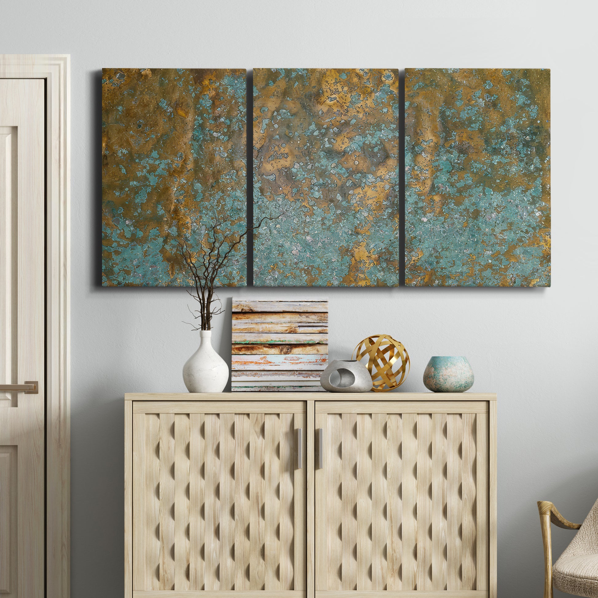 Three-panel canvas wall art featuring earthy copper toned abstract, displayed above a cabinet in an entryway.