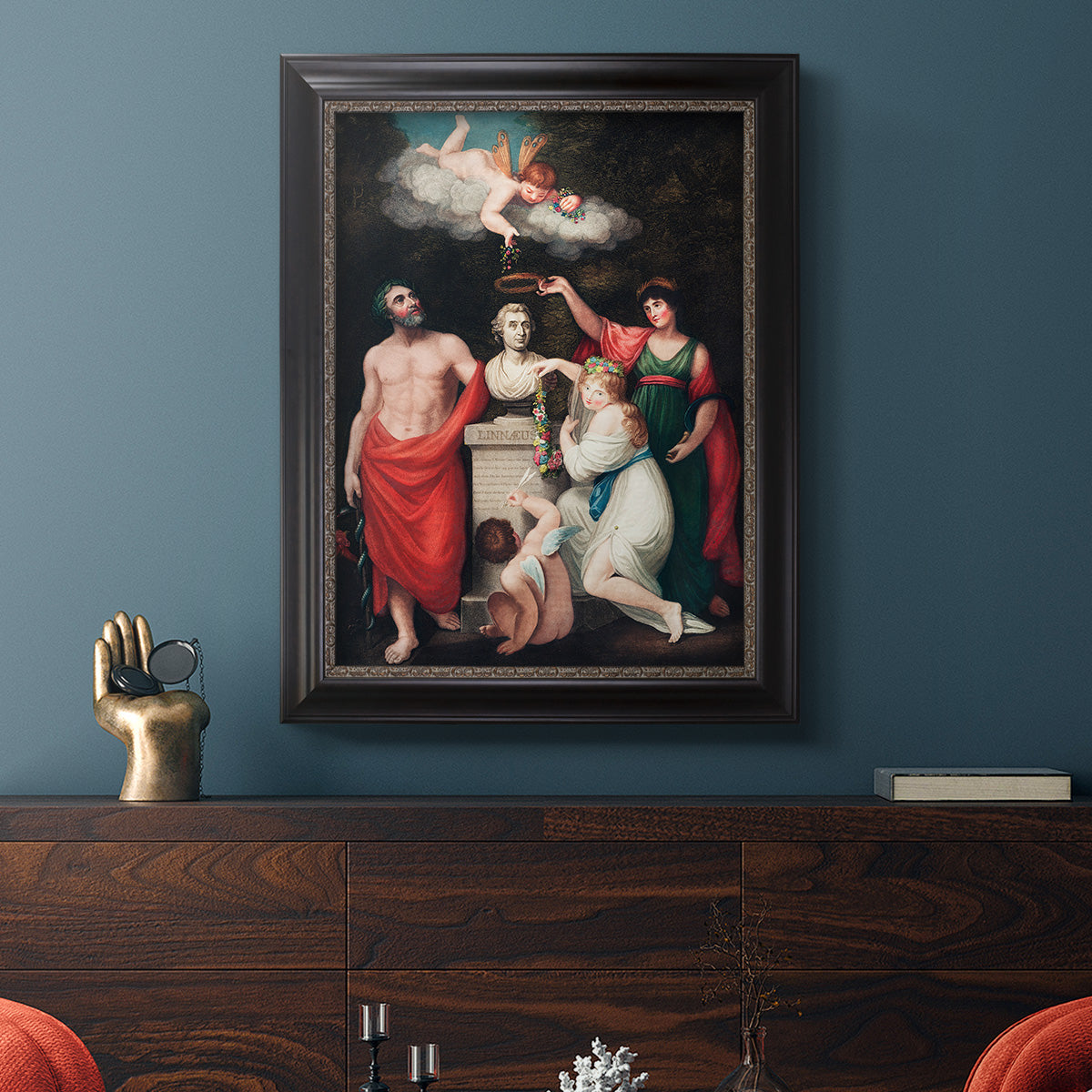 Classical allegorical painting honoring Linnaeus by Robert John Thornton in an ornate black frame with gilded inner detail displayed in a dark-toned interior setting.
