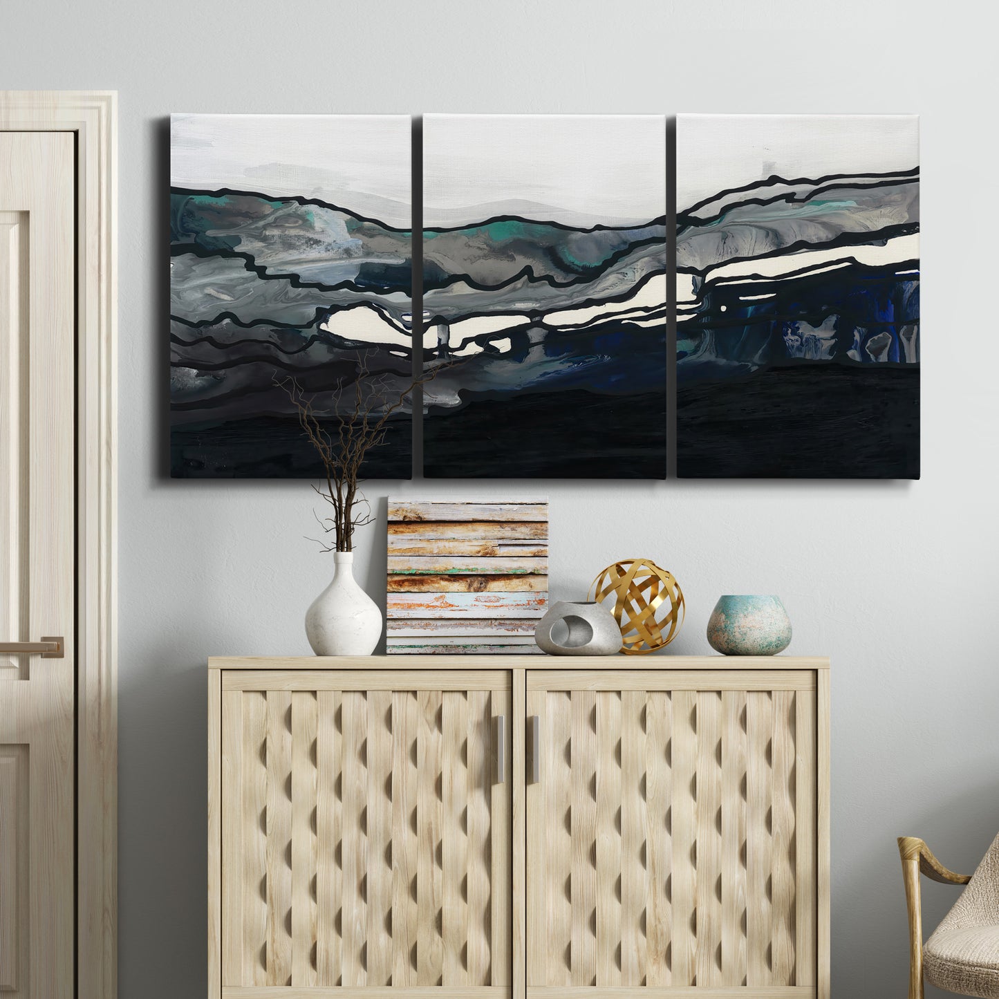 Three-panel canvas wall art featuring abstract passage of time composition, displayed above a cabinet in an entryway.