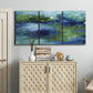 Three-panel canvas wall art featuring flowing blue abstract watercolor, displayed above a cabinet in an entryway.