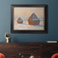Impressionist winter haystack scene by Claude Monet in an ornate black frame with gilded inner detail displayed in a dark-toned interior setting.