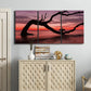Three-panel canvas wall art featuring sunset beach photography, displayed above a cabinet in an entryway.