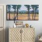 Three-panel canvas wall art featuring quiet morning landscape with trees, displayed above a cabinet in an entryway.