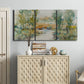 Three-panel canvas wall art featuring trees lining quiet creek, displayed above a cabinet in an entryway.
