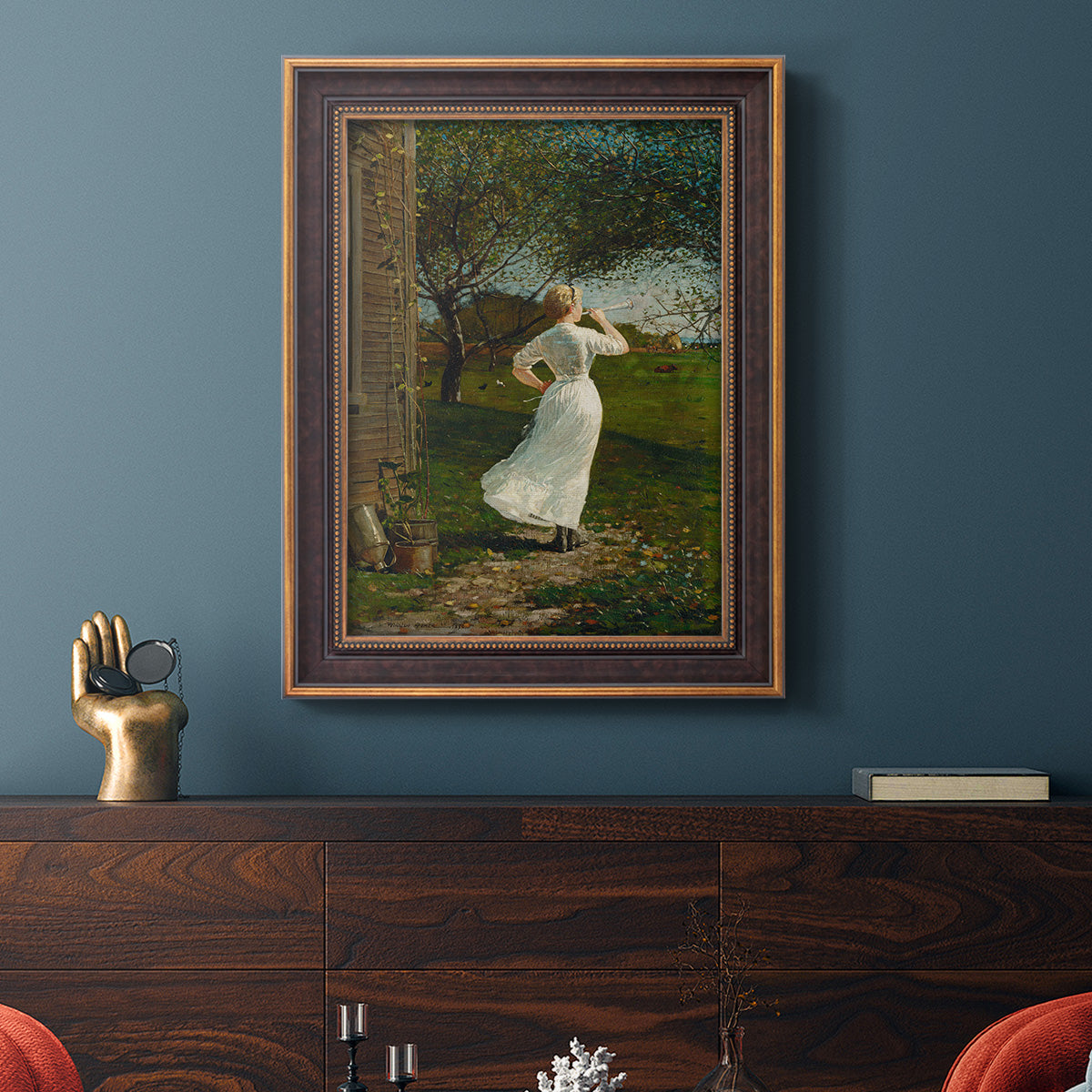 Narrative religious genre scene by Winslow Homer in an ornate bronzed mahogany wood frame displayed in a dark-toned interior setting.