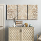 Three-panel canvas wall art featuring ornamental damask abstract pattern, displayed above a cabinet in an entryway.