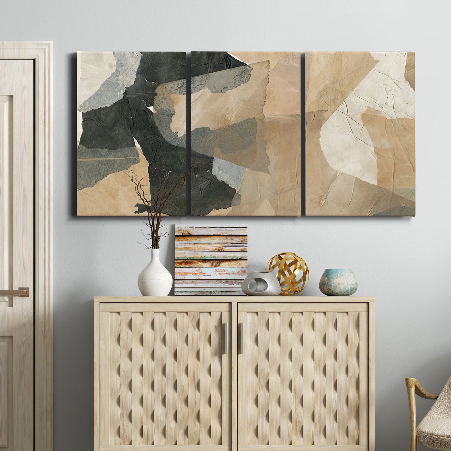 Three-panel canvas wall art featuring blurred mixed media abstract collage, displayed above a cabinet in an entryway.