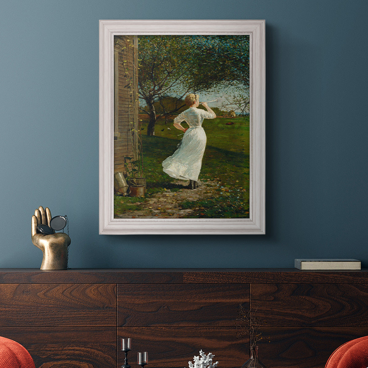 Narrative religious genre scene by Winslow Homer in an ornate weathered white frame displayed in a dark-toned interior setting.