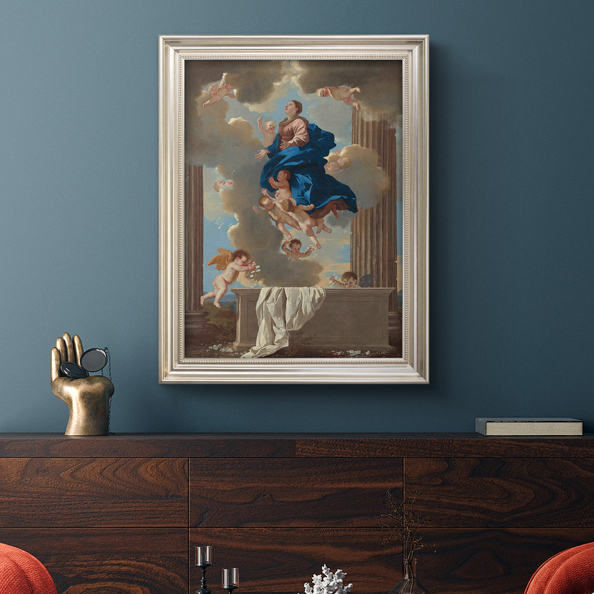 Classical religious depiction of the Assumption of the Virgin by Nicolas Poussin in an ornate champagne frame displayed in a dark-toned interior setting.