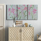 Three-panel canvas wall art featuring pink floral trio arrangement, displayed above a cabinet in an entryway.