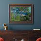 Impressionist Mediterranean coastal landscape by Claude Monet in an ornate bronzed mahogany wood frame displayed in a dark-toned interior setting.