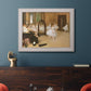 Impressionist dance class interior scene by Edgar Degas in an ornate weathered white frame displayed in a dark-toned interior setting.