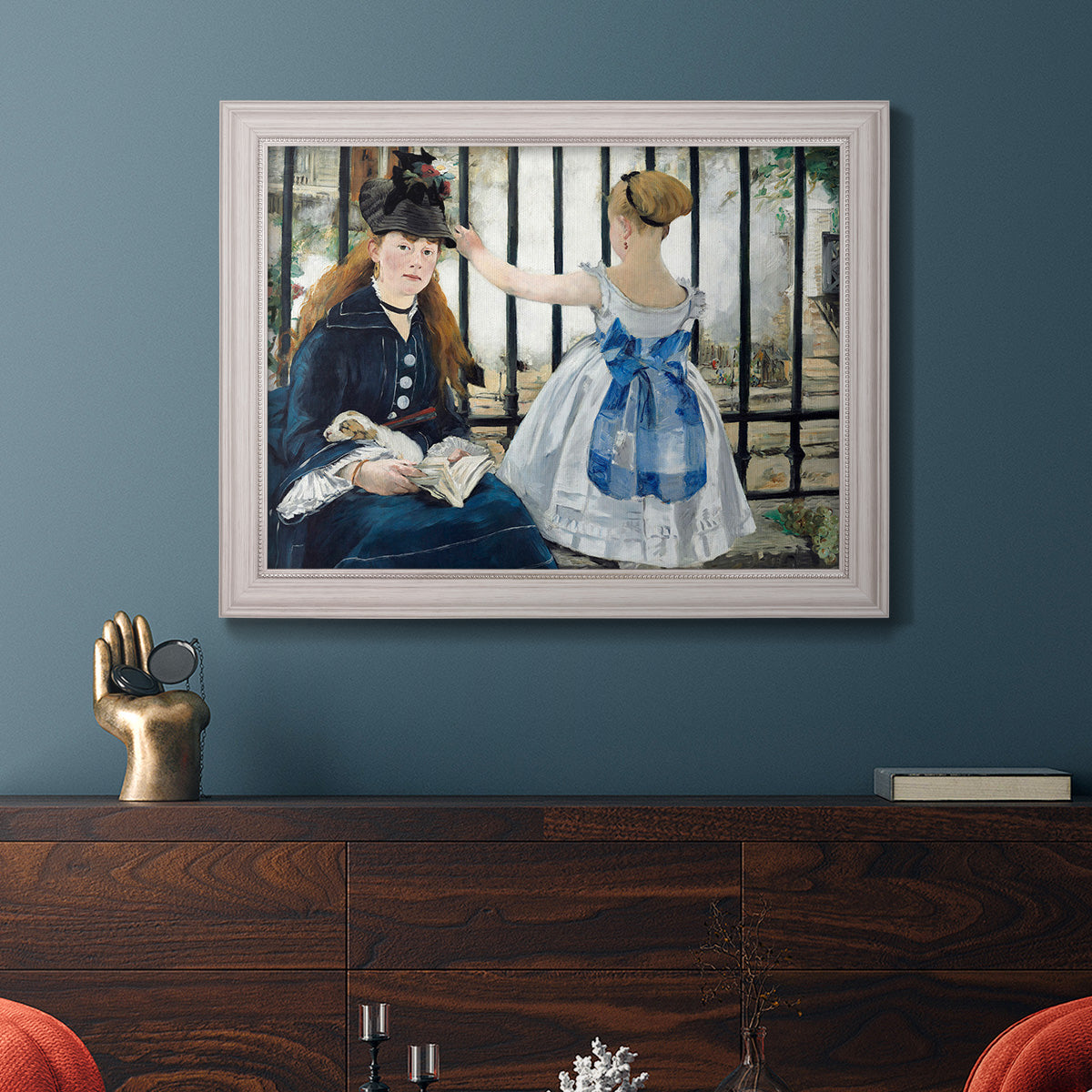 Impressionist urban scene near a railway by Édouard Manet in an ornate weathered white frame displayed in a dark-toned interior setting.