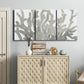 Three-panel canvas wall art featuring monochrome coral texture study, displayed above a cabinet in an entryway.